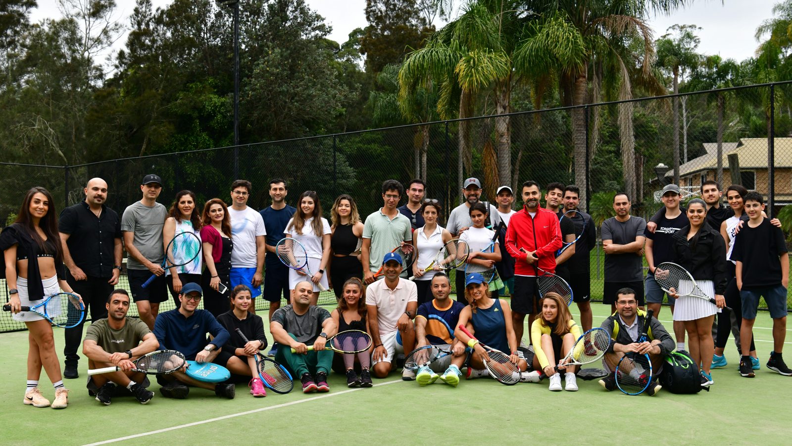 Players together on court at On Court: Tennis & BBQ, Oxford Falls Racquet Club